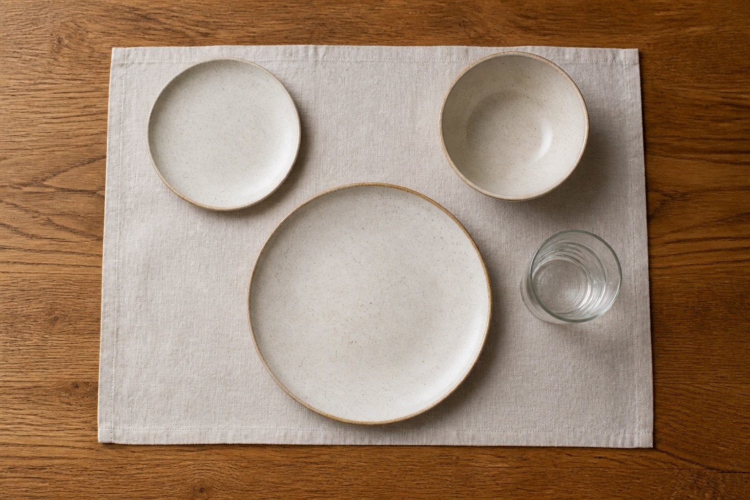 Practical warm neutral stoneware place setting viewed from above
